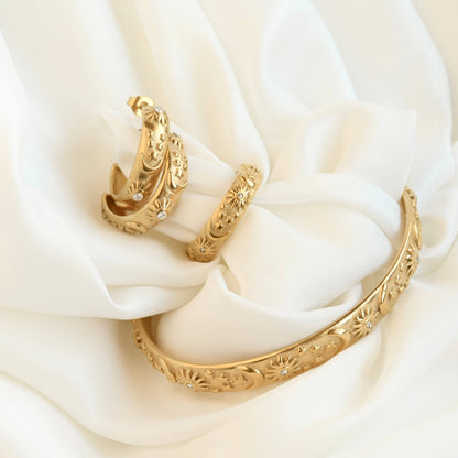 Odessa Sun, Moon, Stars Cuff Bracelet - Embossed Celestial Bracelet: Cuff Bracelet / One Size