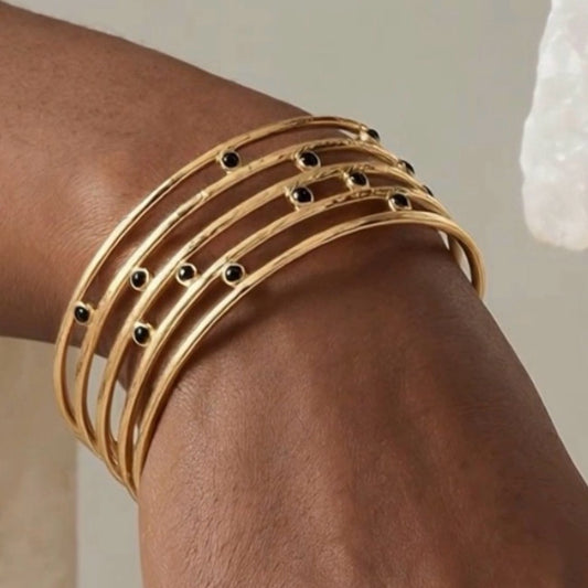 Tiffany Gold Bangle Bracelet with Black Stones