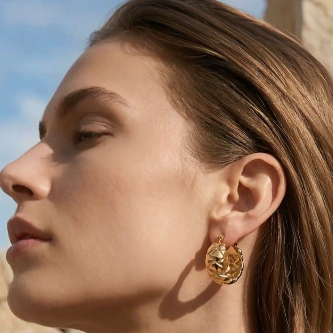 Woven hoop earrings.